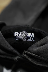 Vintage washed black streetwear hoodie with inner neck branding and RAMM4EVER logo detail shown in a close-up view.